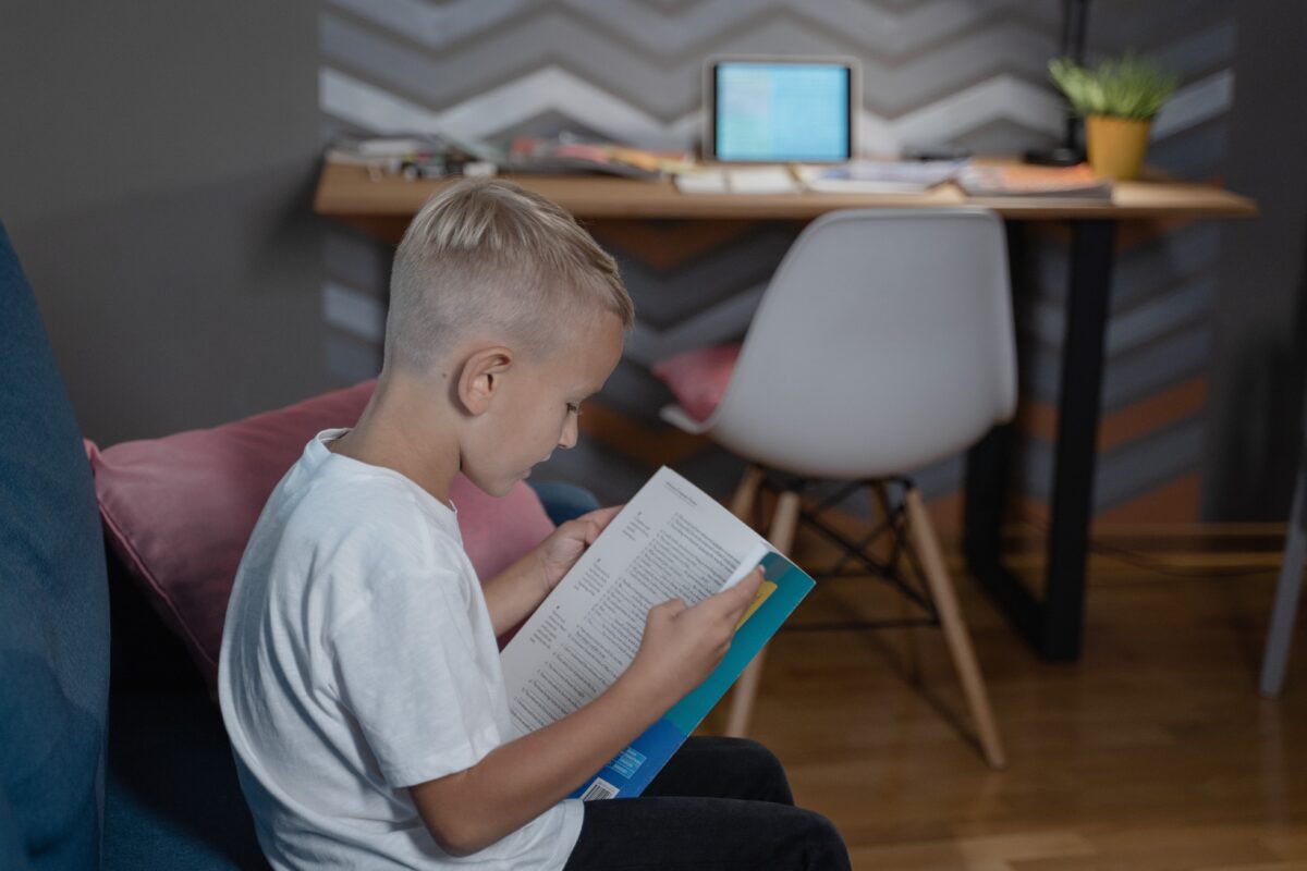 kid reading a book